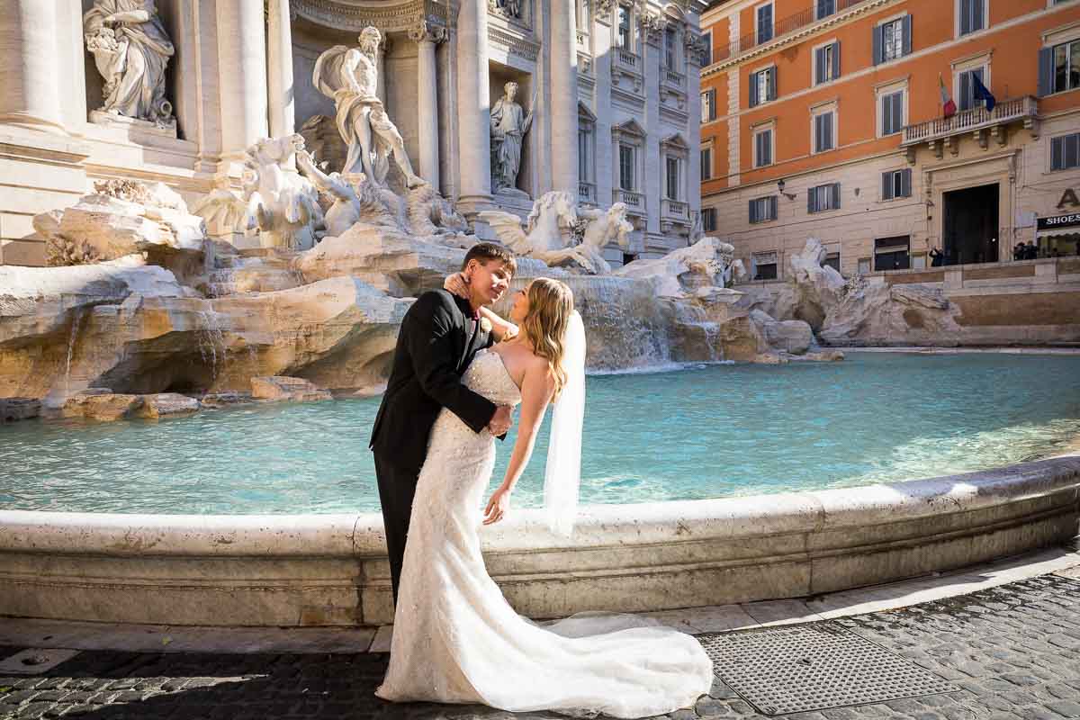 Bride and groom photography at the Trevi fountain in Rome Italy
