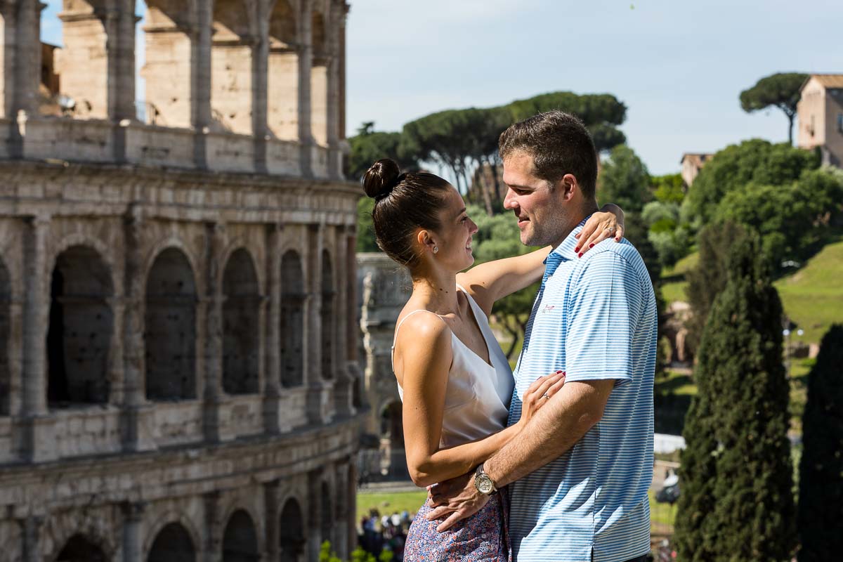 Couple close together next to the Coliseum