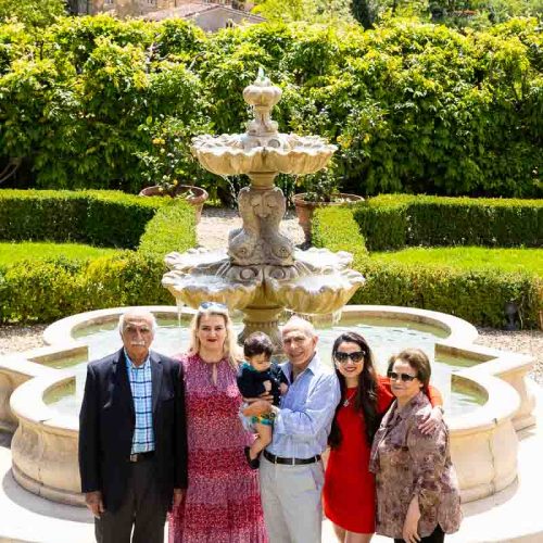 vertical shot showing a family during their photo session in Tuscany Italy