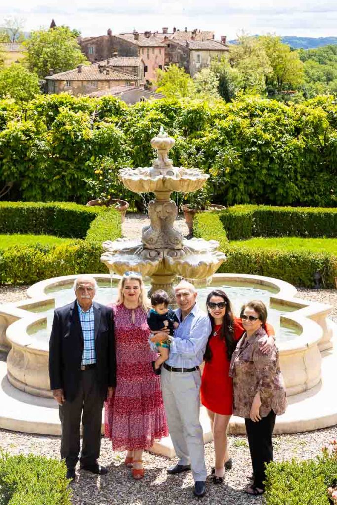 vertical shot showing a family during their photo session in Tuscany Italy