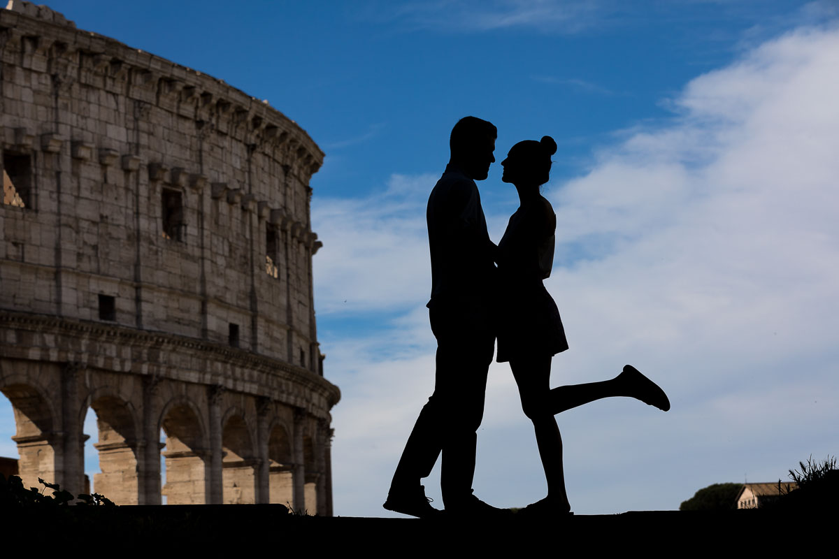 Silhouette picture portrait at the Roman Colosseum. Engagement in Rome Italy