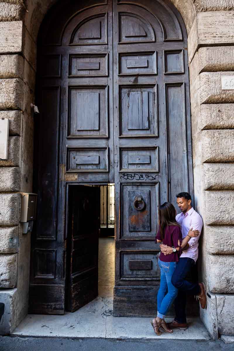 Posed portrait underneath an arch in front of a nice doorway