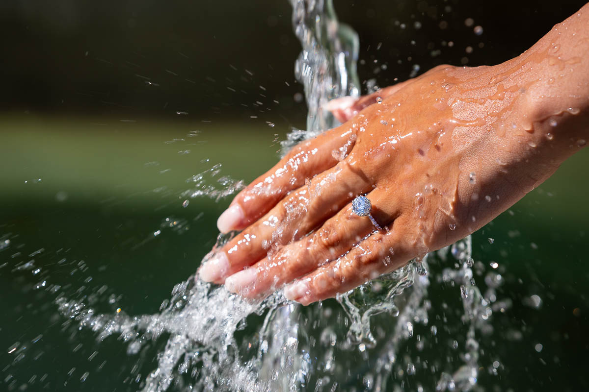 Close up of the engagement ring photographed in splashing water