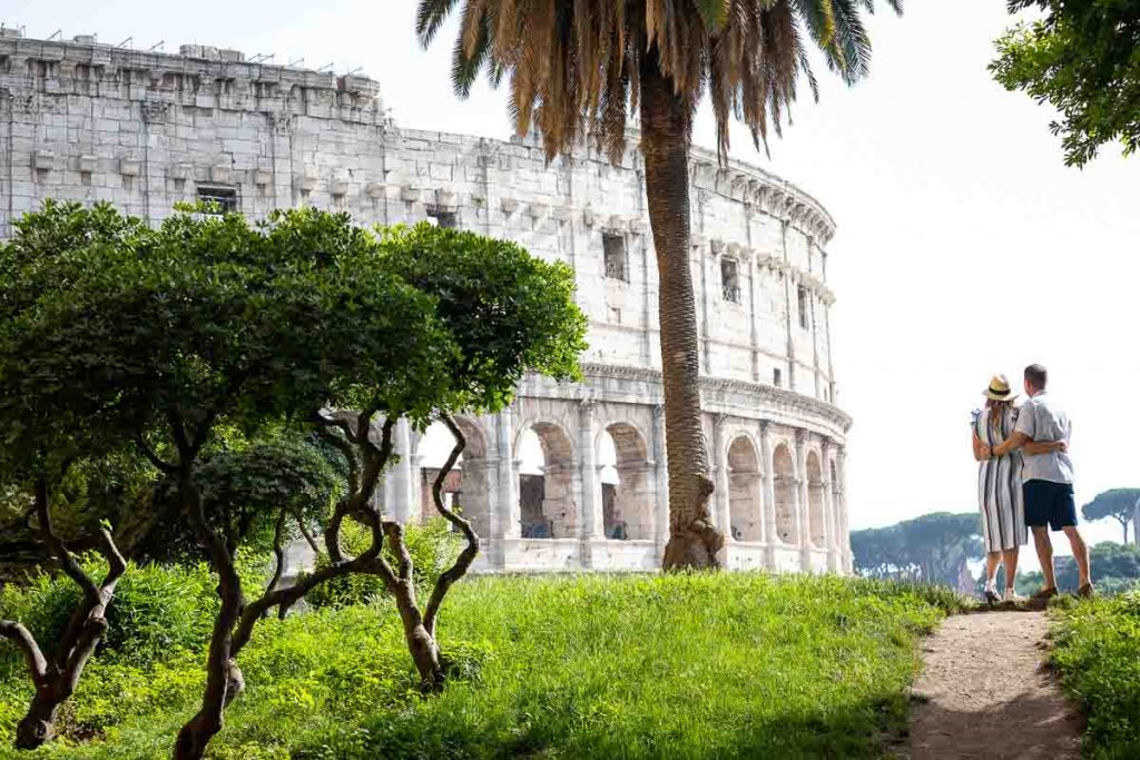 Couple admiring the Coliseum from a distance