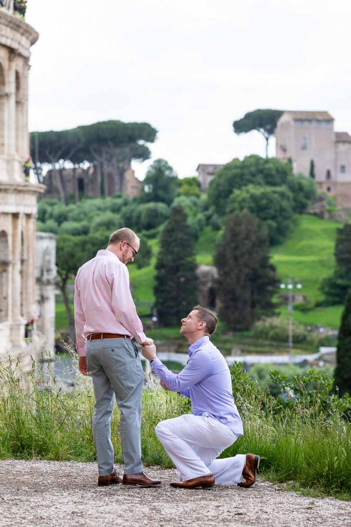 Same sex wedding marriage proposal taking place near the Colosseum in Rome