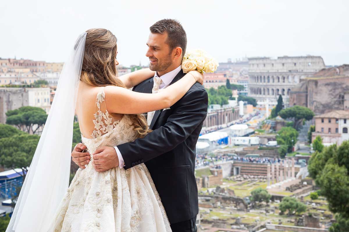 Newlyweds portrait overlooking the city of Rome in the distance