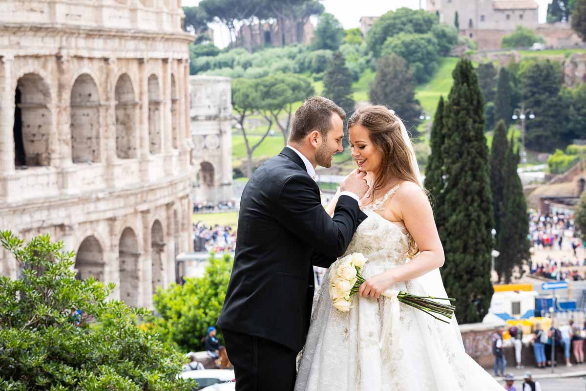 Groom and bride photo session at the Roman Colosseum in Rome Italy