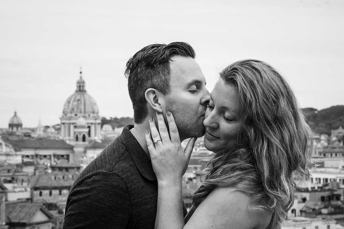 Couple portrait image in black and white with the ancient city of Rome in the background