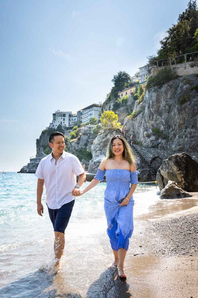 Couple walking on the beautiful beaches of the Amalfi coast during a photography session