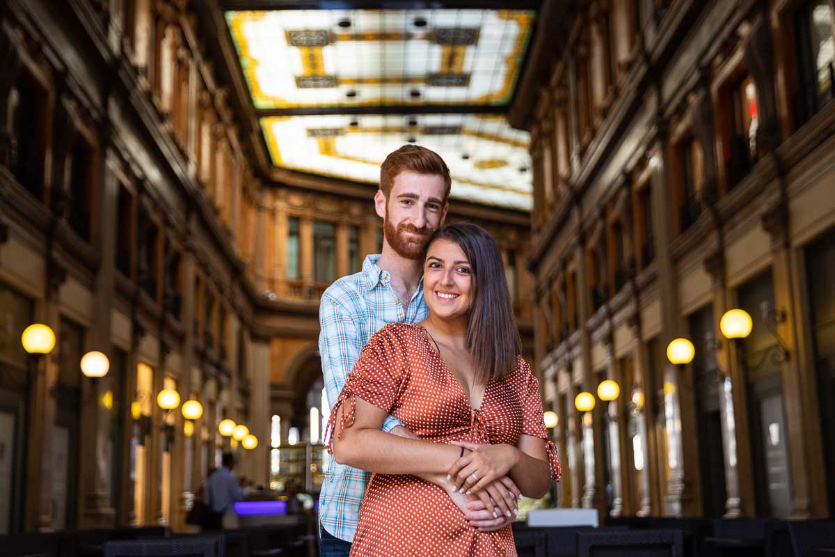 Closeup couple portrait standing inside Galleria Colonna