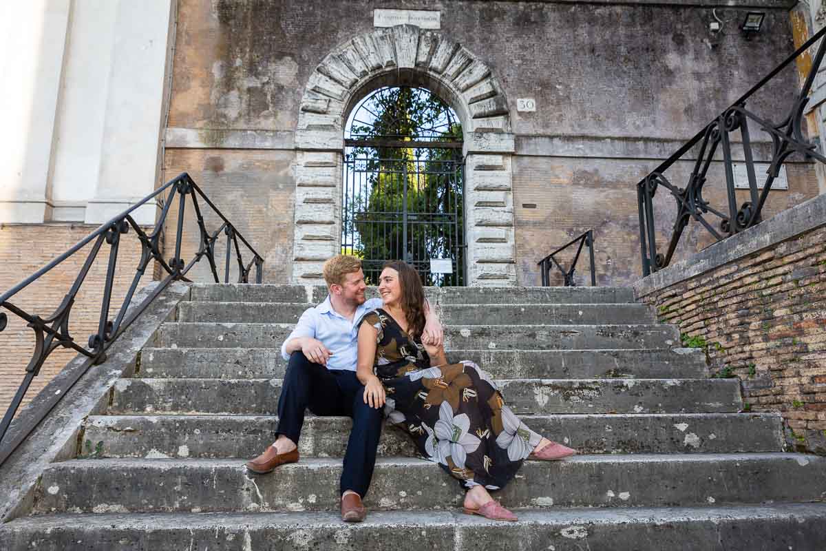 Posed couple sitting down on side steps