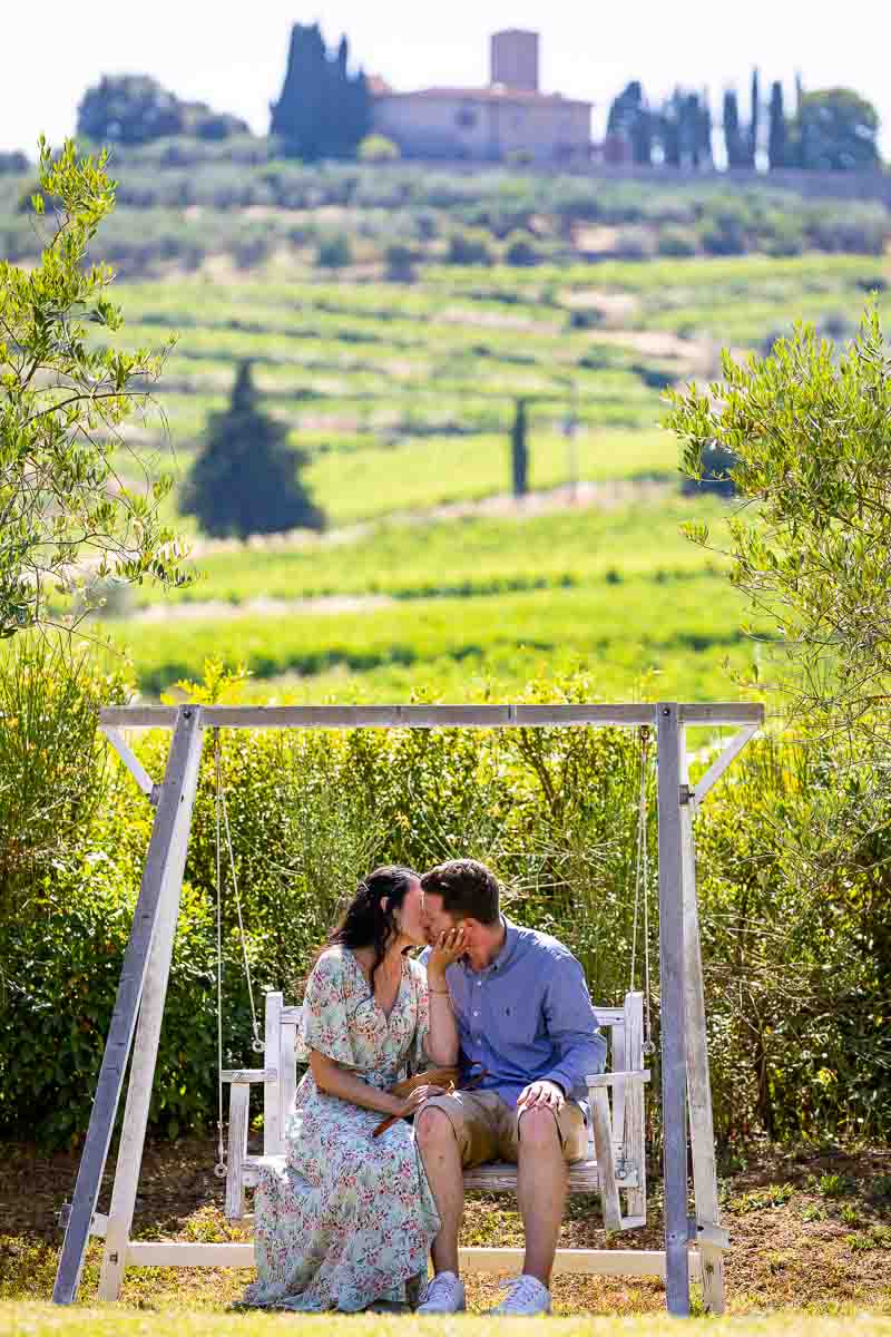 Couple kissing in Italian tuscany countryside