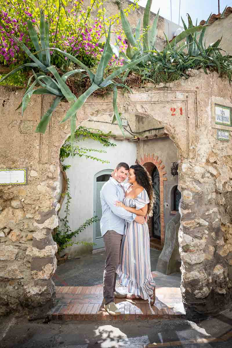 Posed portrait picture standing underneath an arc in the ancient town of capri