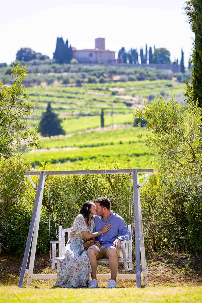 Couple kissing sitting down on a rocking chair