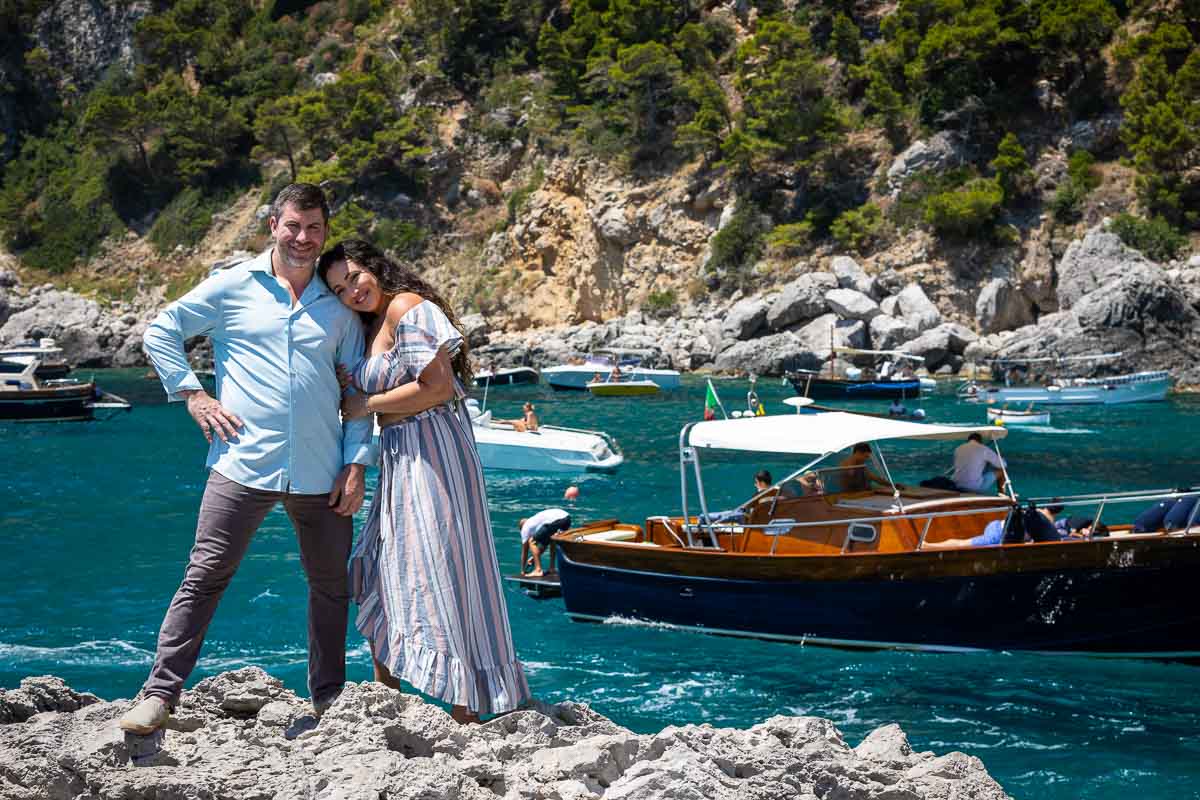 Posing on the other side of the island by marina piccola with beautiful water and boats in the background