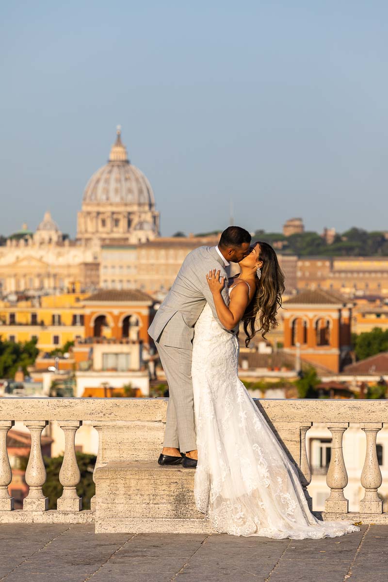 Wedding kissing picture before the roman skyline during a photohoot