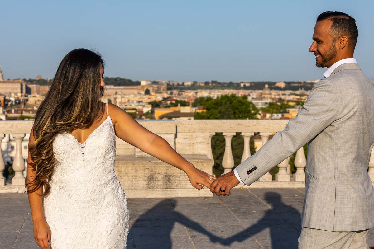 Couple holding hands with their wedding rings