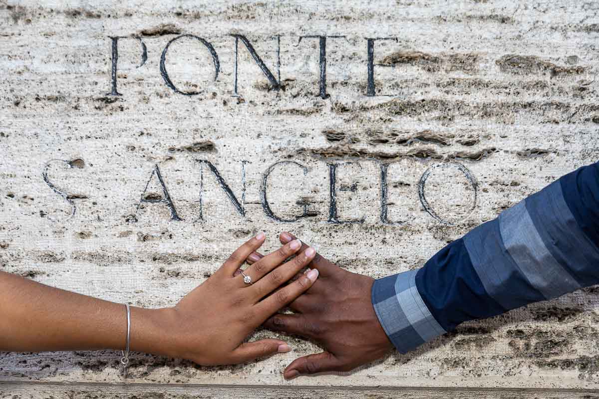 Engagement ring photography underneath the marble ponte sign