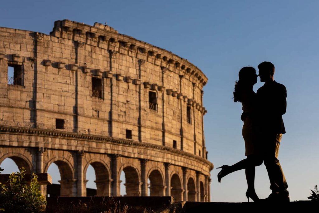 Silhouette photo of a couple posing during an engagement photo shoot in Rome at the Colosseum