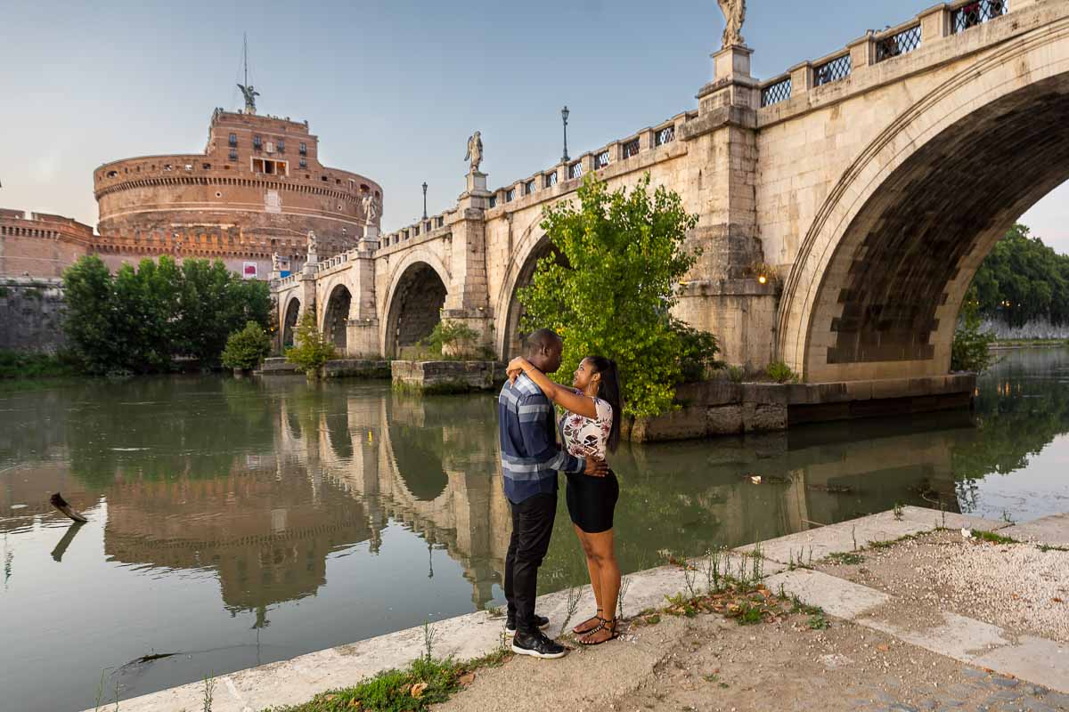 Standing under the bridge next to the Tiber river bank