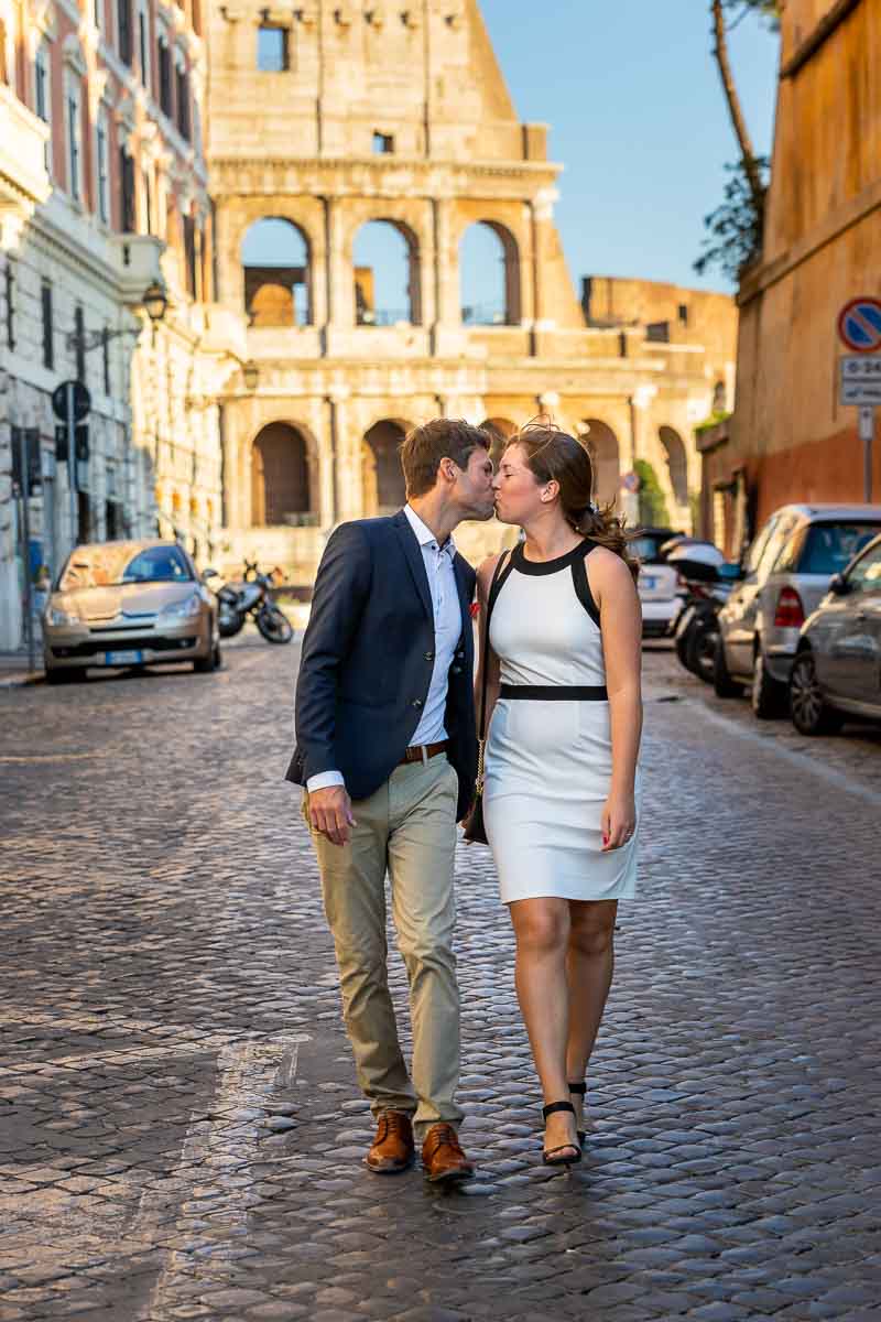 Walking in Rome while kissing on ancient cobble stone alleyway street