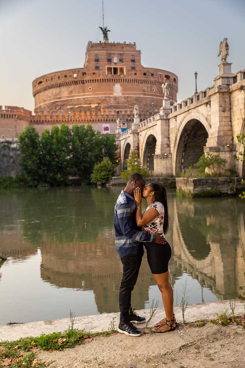 Kissing before the Angel Castle in Rome Italy