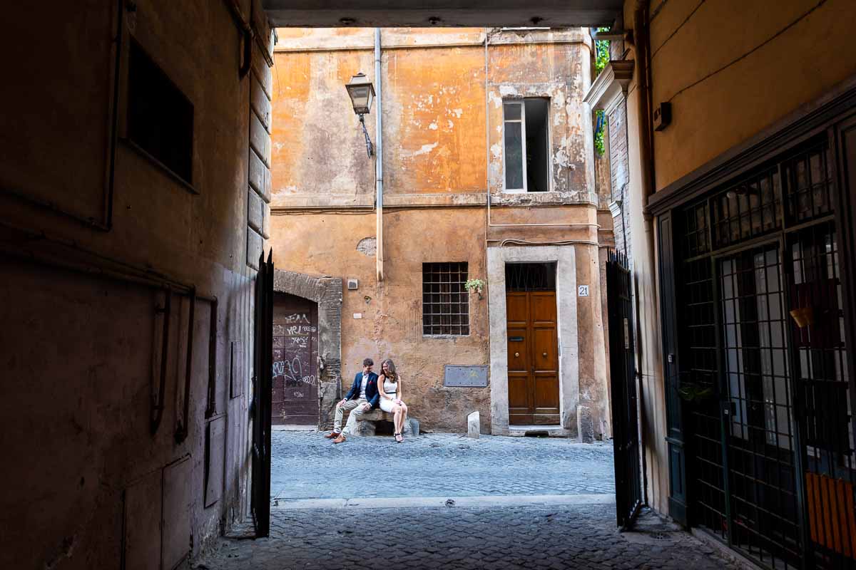 Sitting down on a roman alley posing for a picture