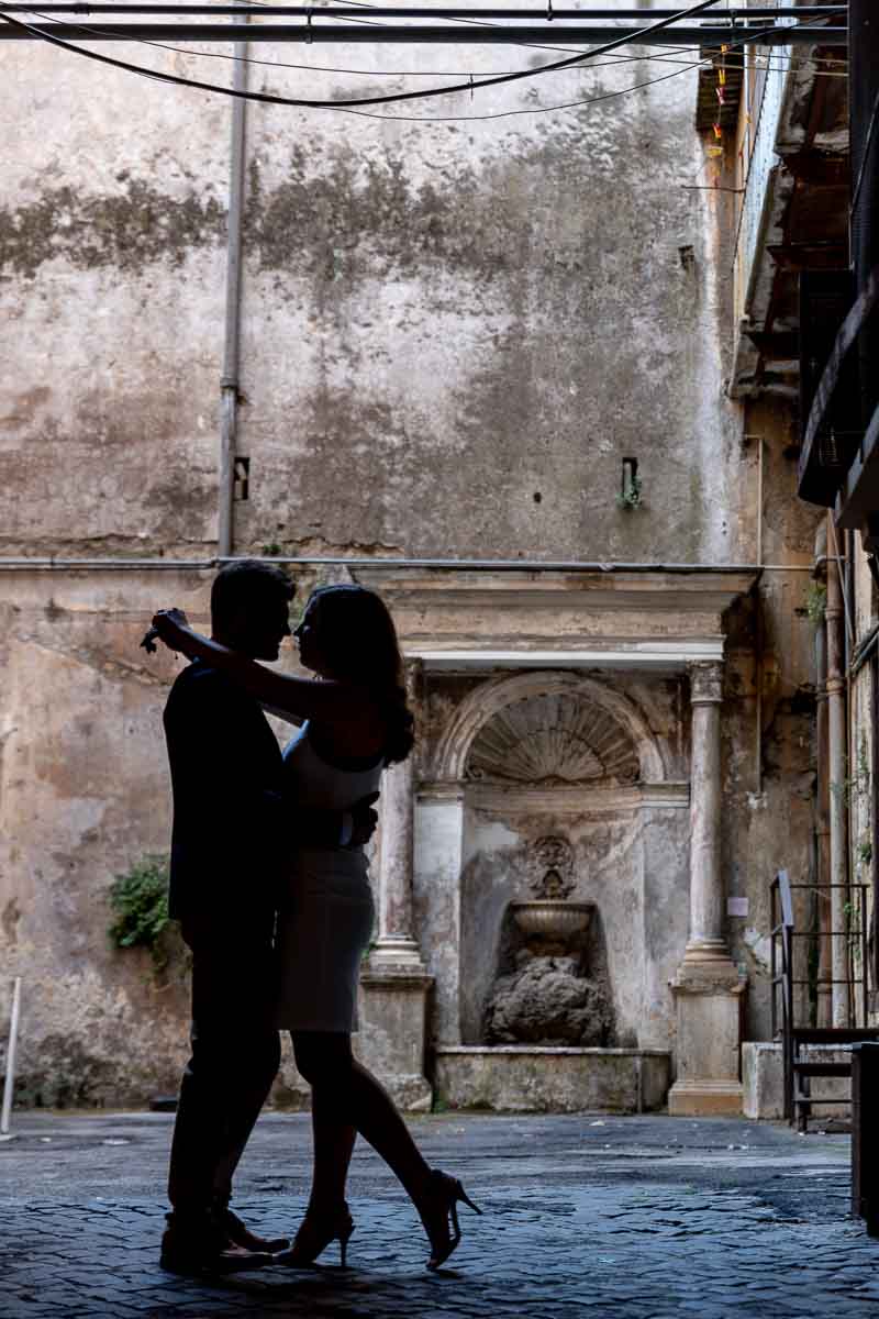 Silhouette image of a couple surrounded in a roman environment