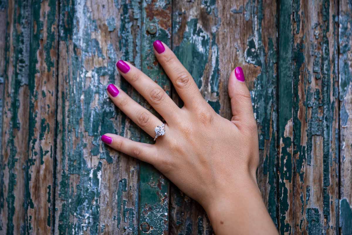 Close up photography of the engagement ring on hand