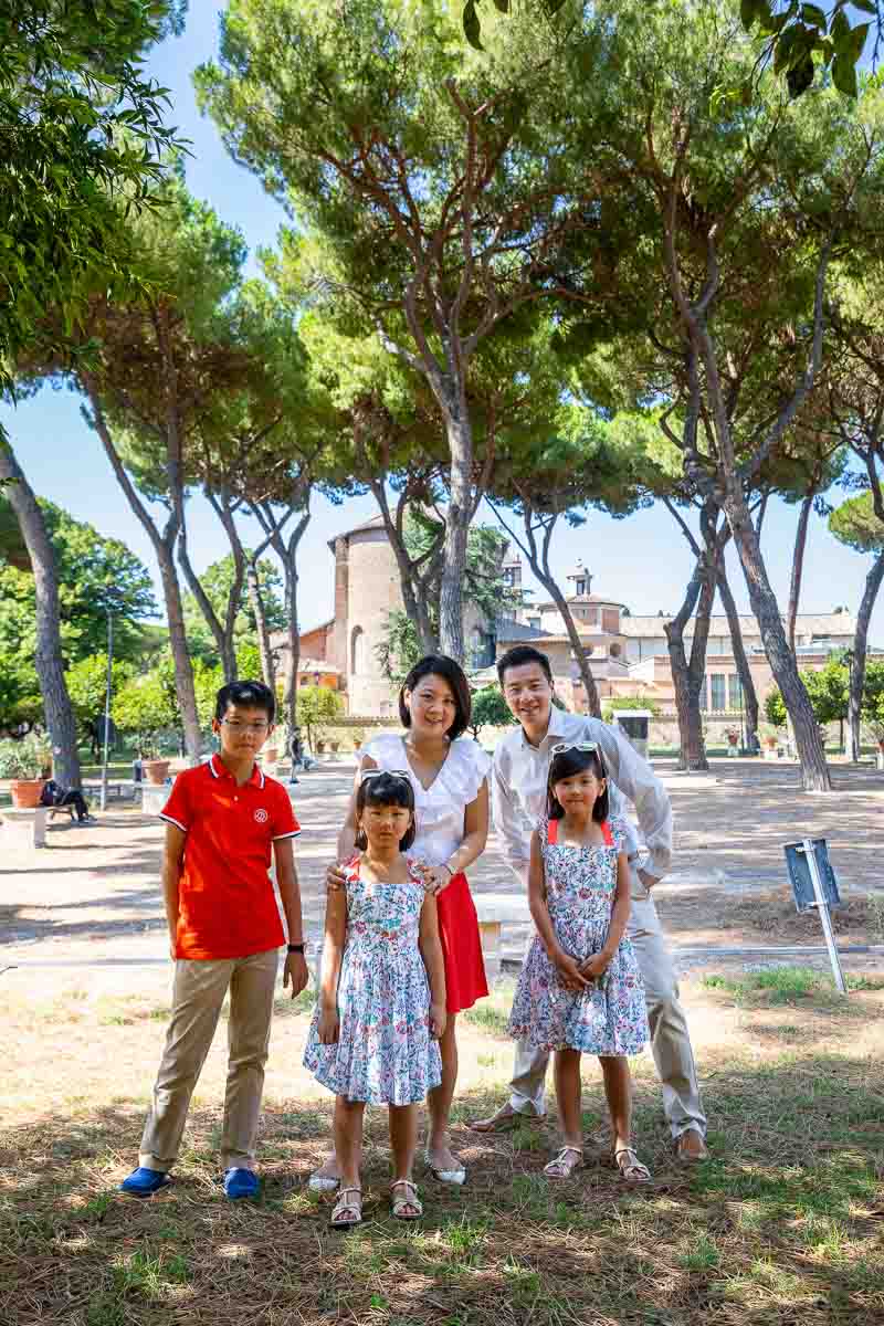 Family group photo taken inside the Orange Gardens on the Aventine Hill in Rome Italy