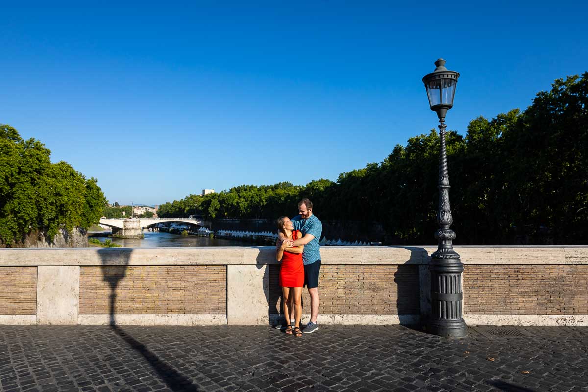 Taking pictures together during a photo shoot on Ponte Sisto bridge in Rome