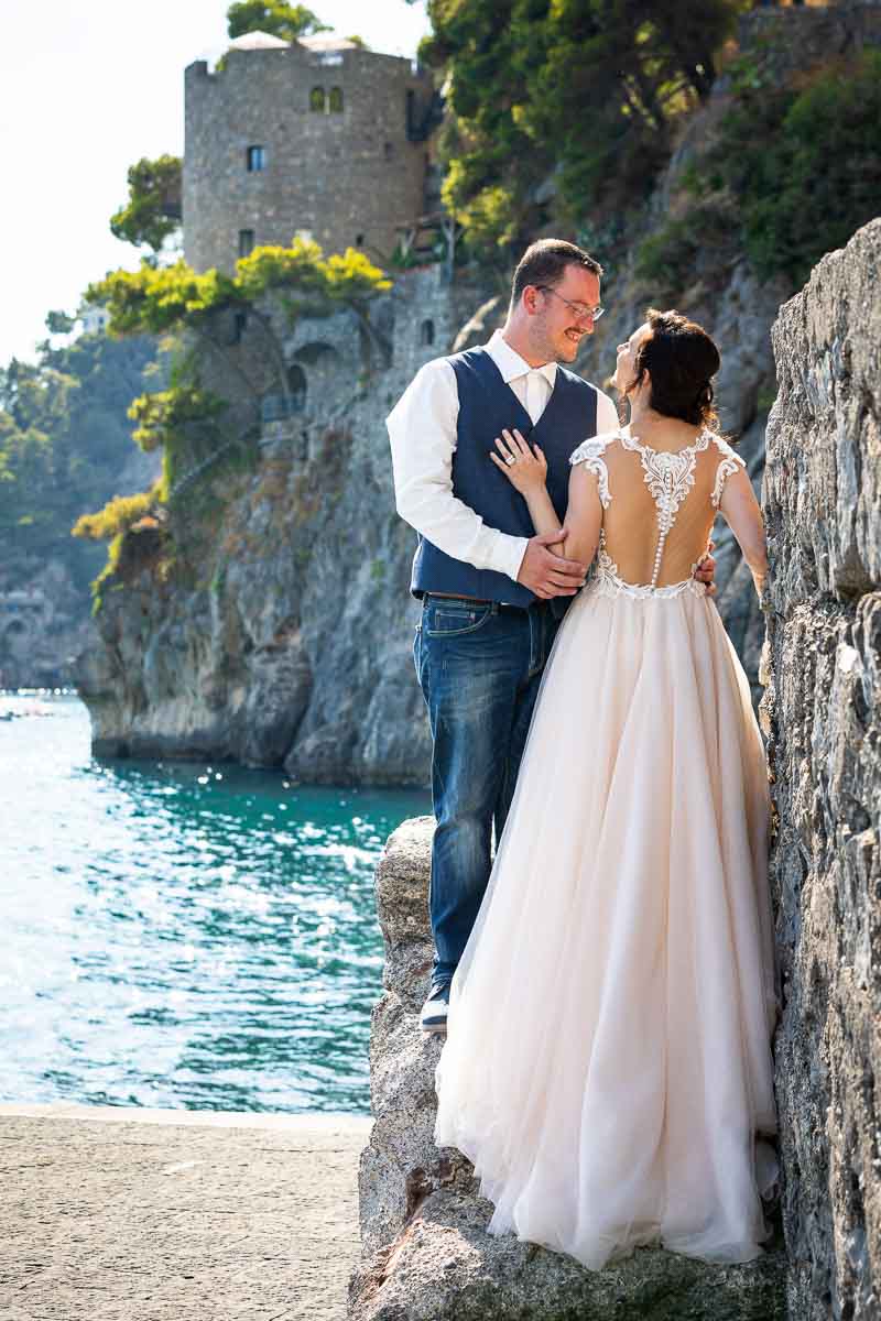 Bridal dress photographed on a beach like environment with the sea in the background during a Elopement Wedding in Positano
