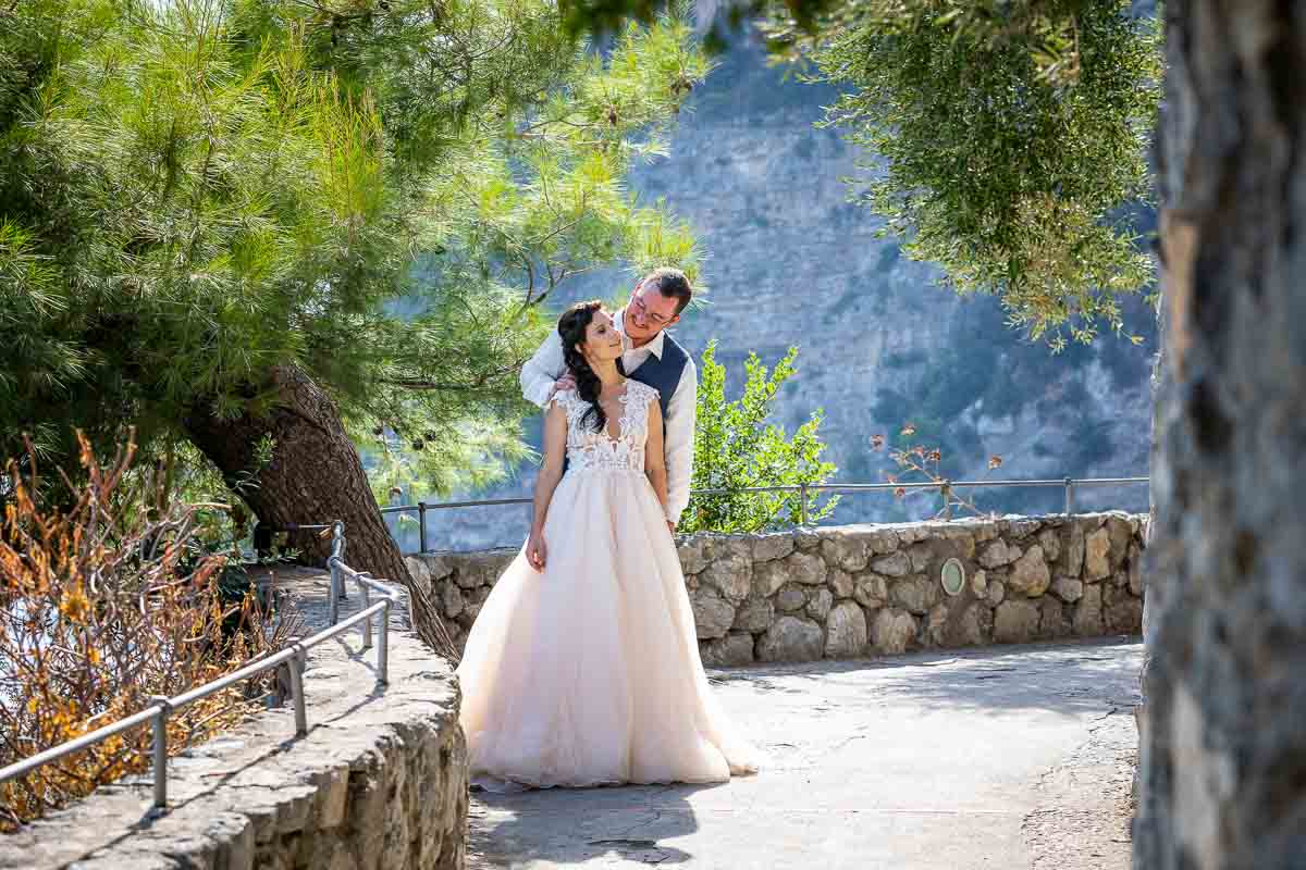 Posed image of being together during a matrimonial photo session in a Mediterranean Italian setting