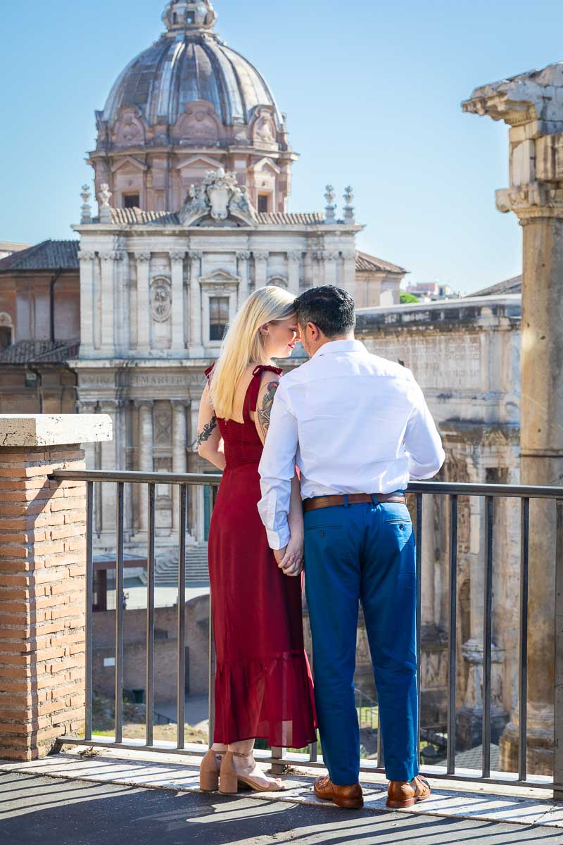 Posed photoshoot portrait standing in front of the Roman Forum. Destination Couple Photoshoot in Rome