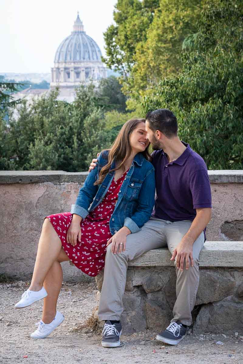 Couple photoshoot portrait with Rome's Saint Peter's Basilica dome in the backdrop