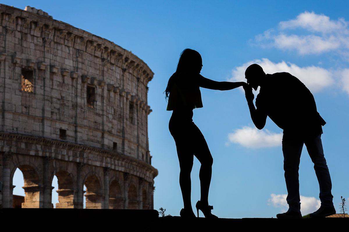 Chivalry moment at the Coliseum in silhouette image. Rome Photoshoot by the Andrea Matone photographers
