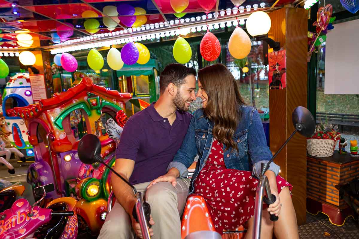 Couple engaged portrait picture on an amusement ride