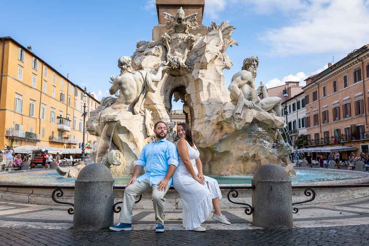 Destination Engagement Rome PhotoShoot taking pictures in the middle of Piazza Navona under the central obelisk water fountain of the 4 rivers