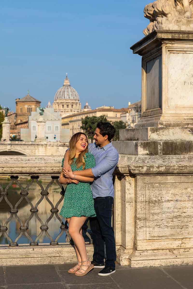 Portrait picture posing on the side of the bridge with Saint Peter's cathedral in the far distance with soft nice morning light