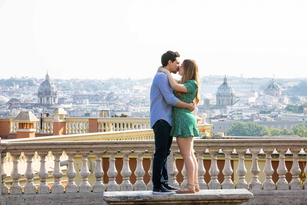 In love over the ancient city of Rome posing on a marble bench with the city view crisp clear in the backdrop photoshooting in Rome