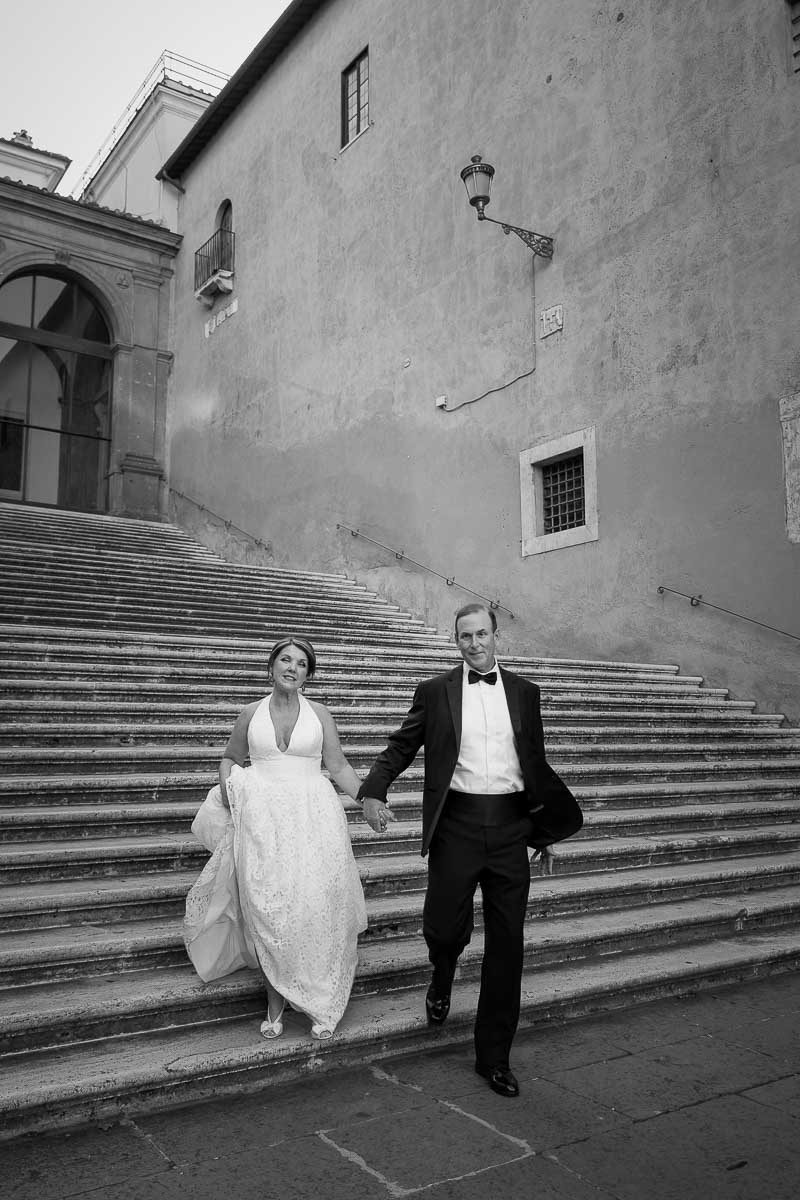 Black and white photography walking down steps in Piazza del Campidoglio 