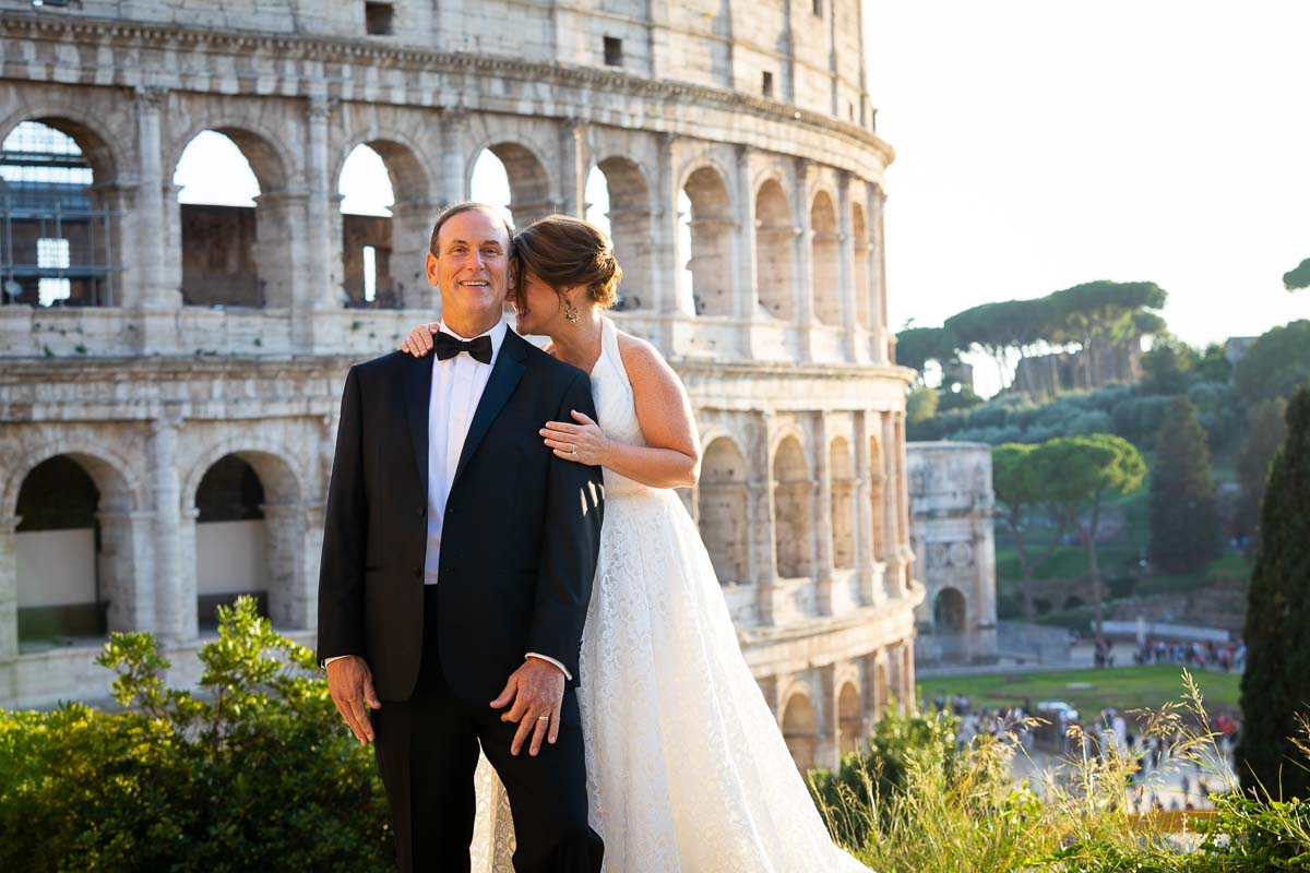 Posing picture of the bride and groom at the Coliseum in Rome Italy 