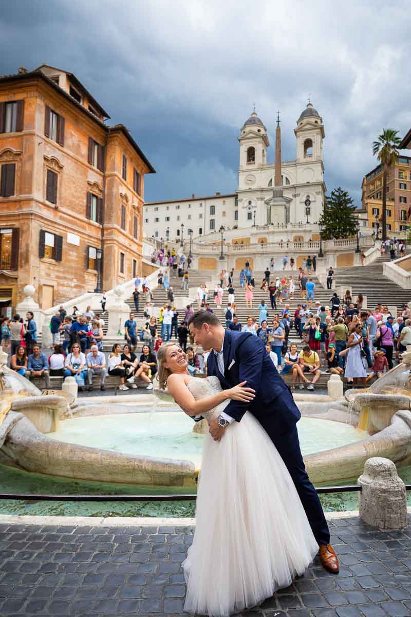 Wedding photoshoot at the Spanish steps in front of the fountain and the staircase