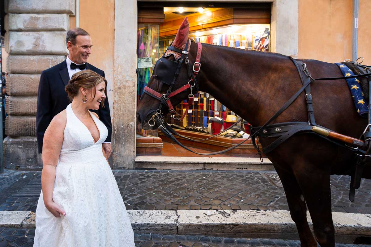 Taking a picture together with a carriage horse 