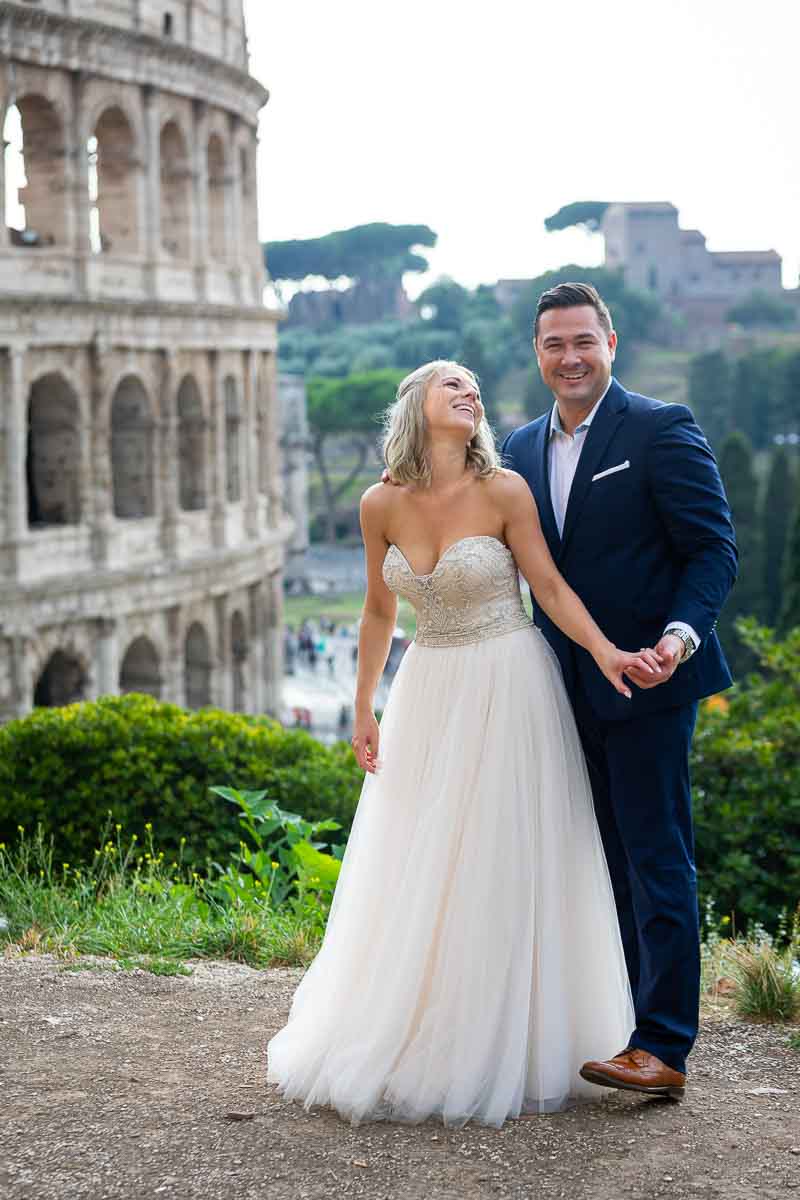 Taking pictures of the groom and bride by the Coliseum