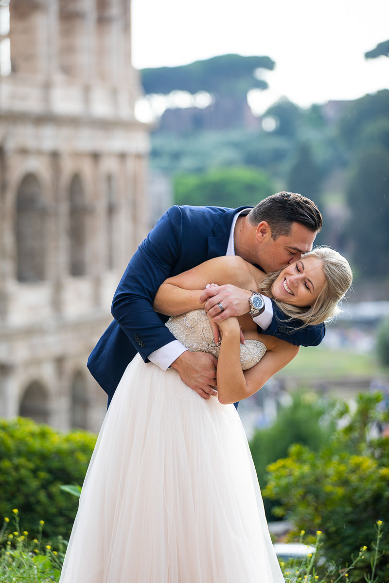 Having fun during your wedding photo session at the Colosseum in Rome Italy