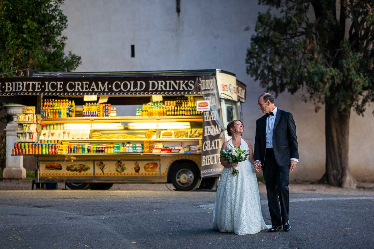 Walking together at the end of day with a typical drinks selling stand 