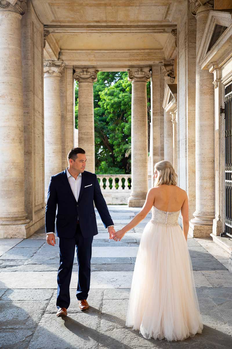 Reaching out to hold each other's hand during a photo shoot