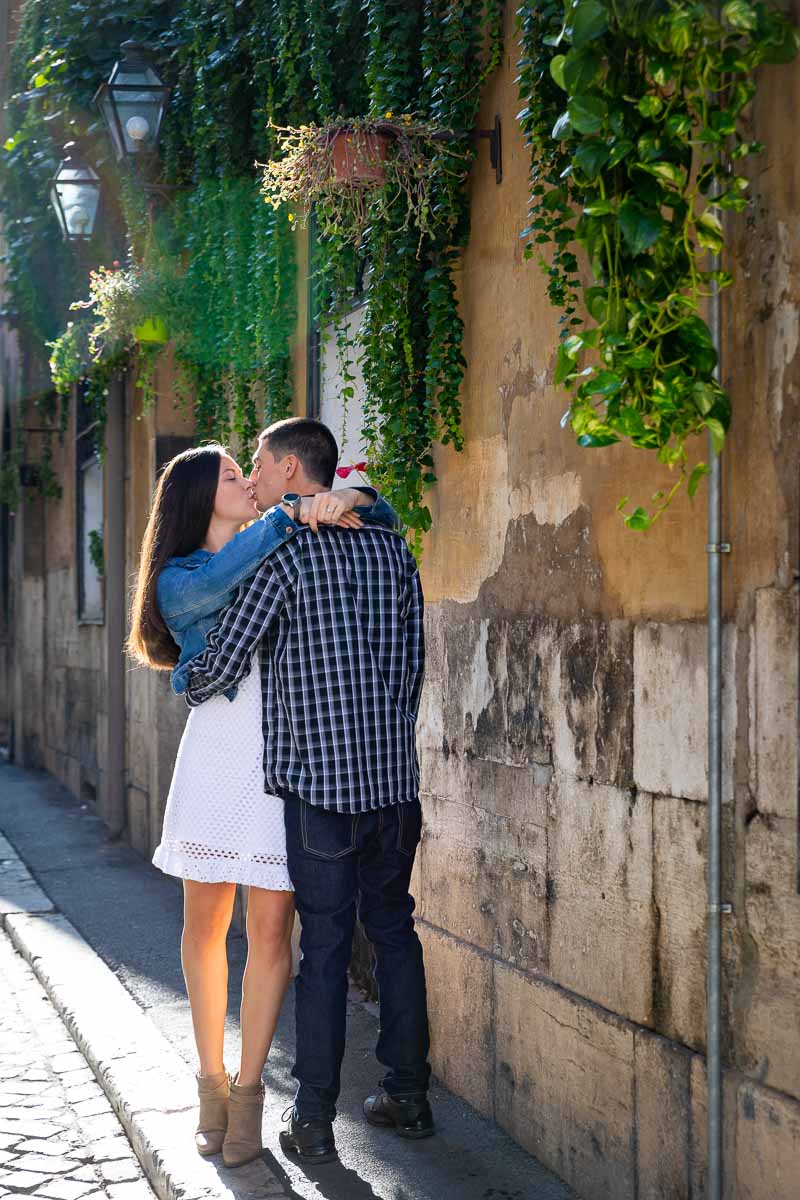 Kissing in the streets of Rome Italy during a photo shoot. Rome Engagement Pictures