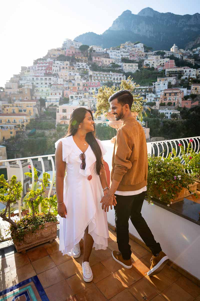 Posed photo of a newly engaged couple looking at each other.